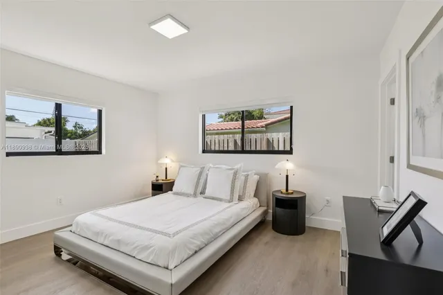 a bedroom with a bed and a couch