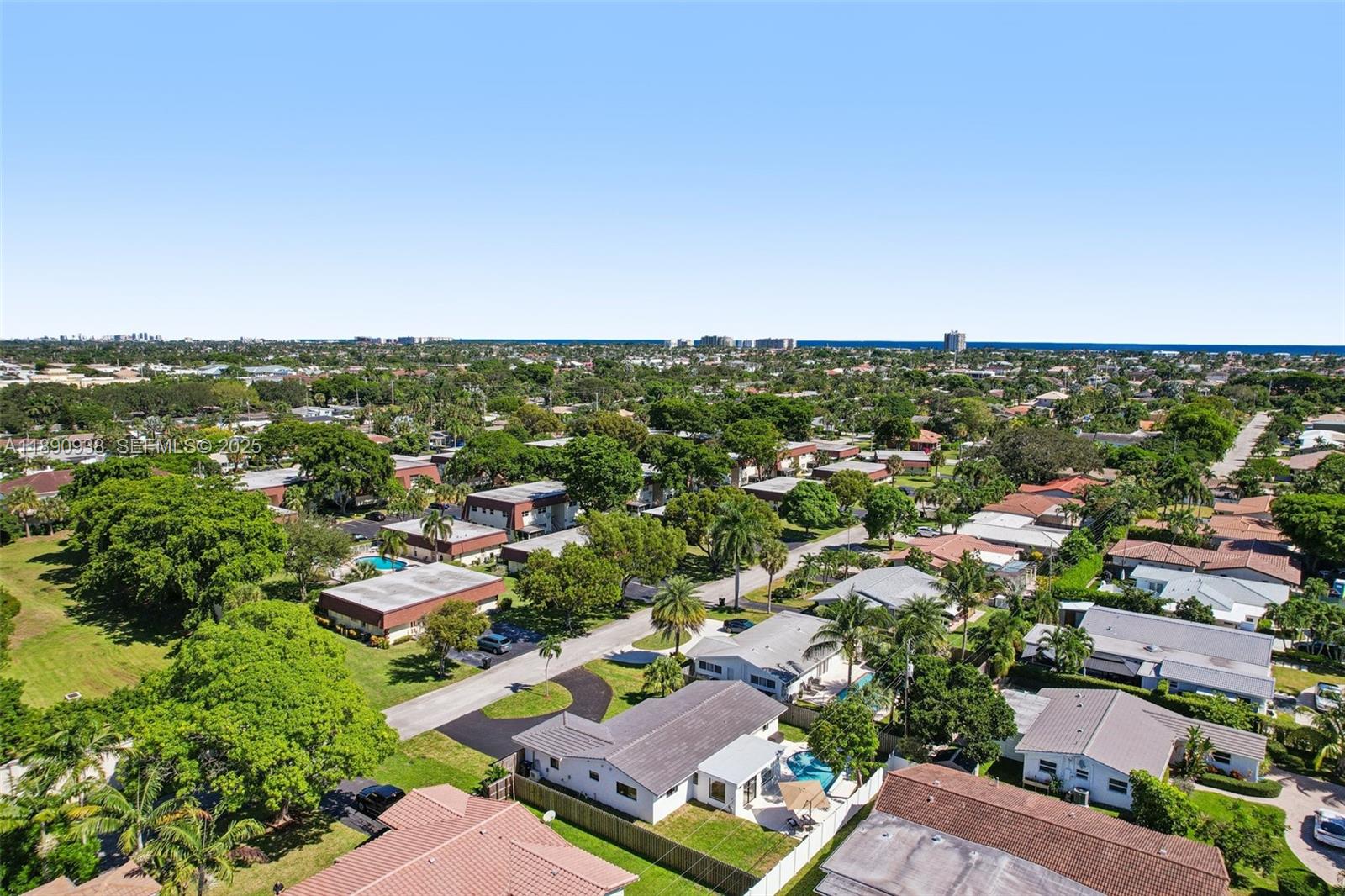 1960 Northeast 32nd Street Lighthouse Point, FL 33064 - Photo 39 of 40 an aerial view of residential houses with outdoor space and trees