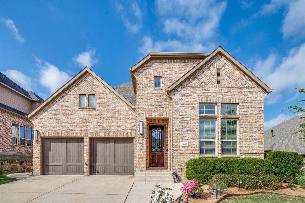 1011 Riviera Road Roanoke, TX 76262 - Photo 1 of 28 Welcoming Fairway Ranch exterior with landscaped entry