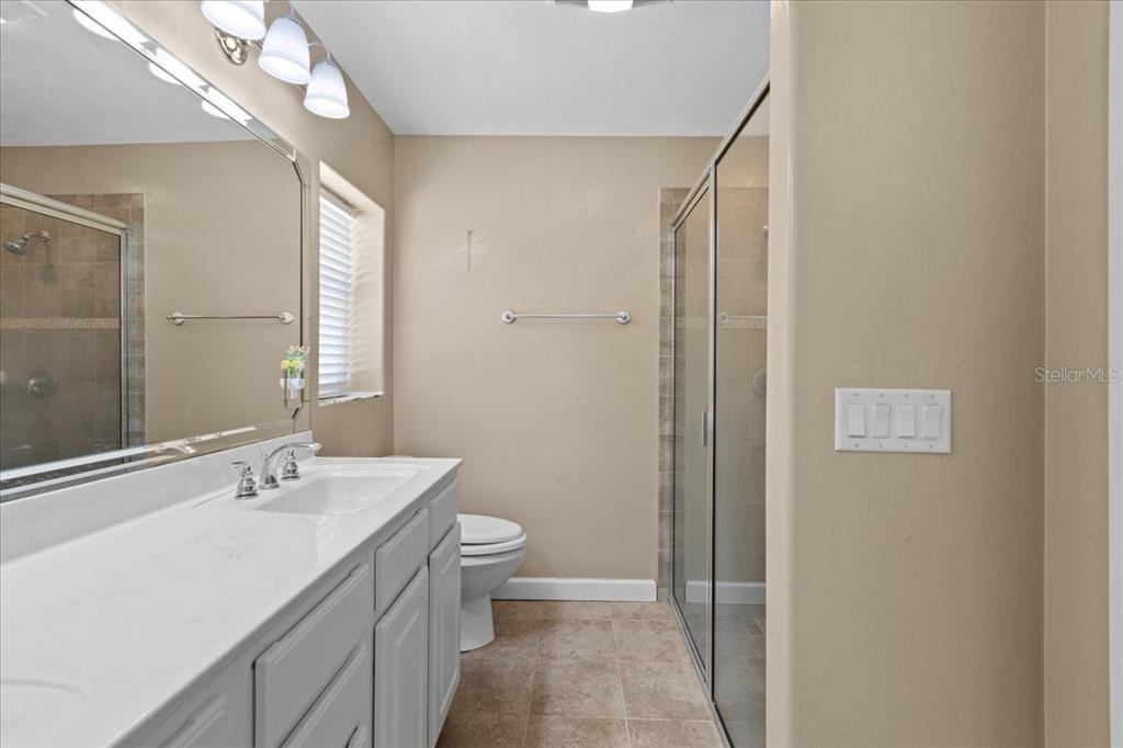 4700 Northwest 55th Avenue Bell, FL 32619 - Photo 14 of 77 a bathroom with a toilet a sink and mirror