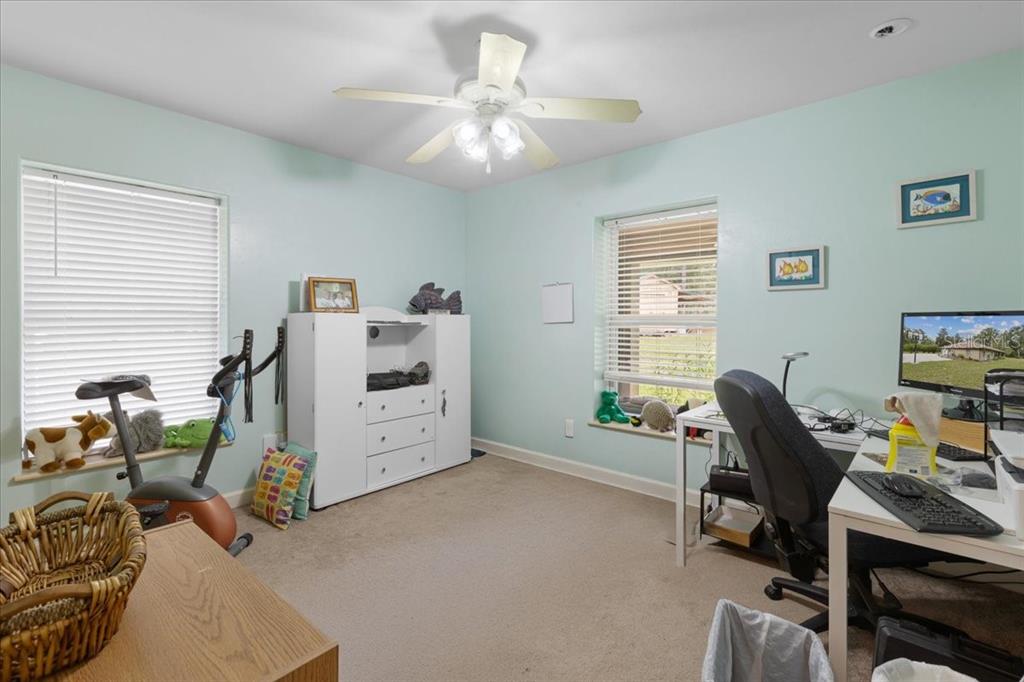 4700 Northwest 55th Avenue Bell, FL 32619 - Photo 19 of 77 a view of a workspace with furniture and a window