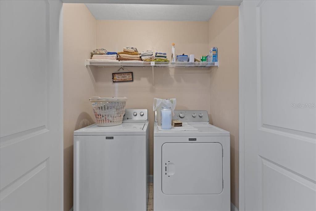 4700 Northwest 55th Avenue Bell, FL 32619 - Photo 20 of 77 a view of storage and utility room with washer and dryer