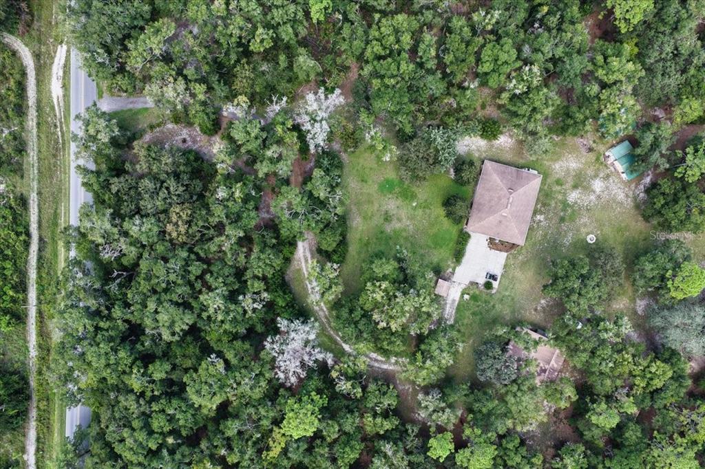 4700 Northwest 55th Avenue Bell, FL 32619 - Photo 33 of 77 an aerial view of residential house with outdoor space and trees all around