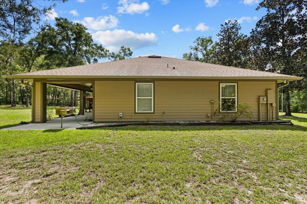 4700 Northwest 55th Avenue Bell, FL 32619 - Photo 43 of 77 a front view of a house with garden