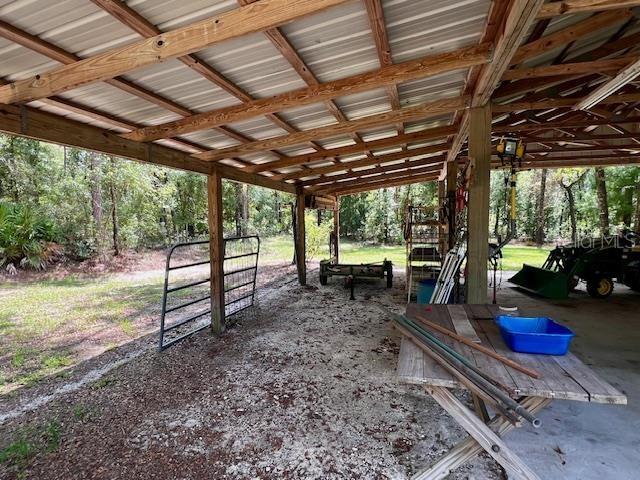 4700 Northwest 55th Avenue Bell, FL 32619 - Photo 57 of 77 a view of a backyard with wooden fence and a patio