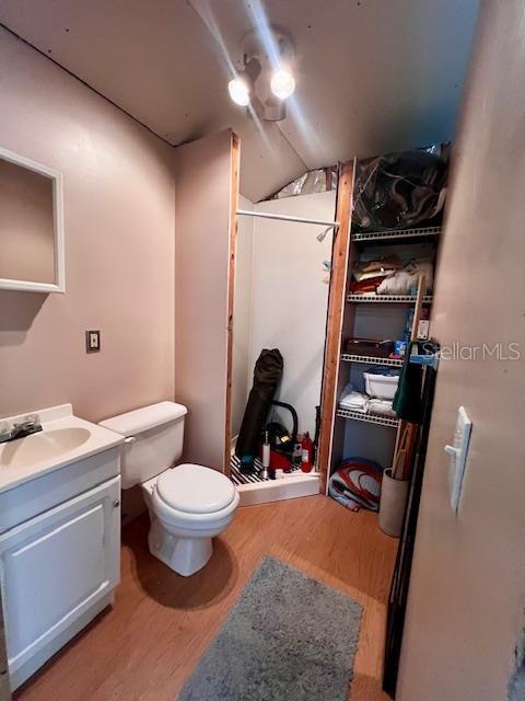 4700 Northwest 55th Avenue Bell, FL 32619 - Photo 64 of 77 a bathroom with a toilet sink and mirror