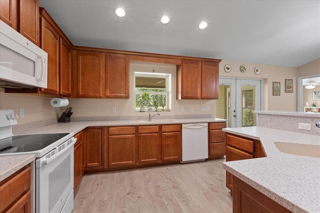 4700 Northwest 55th Avenue Bell, FL 32619 - Photo 8 of 77 a kitchen with stainless steel appliances granite countertop a sink dishwasher stove and refrigerator