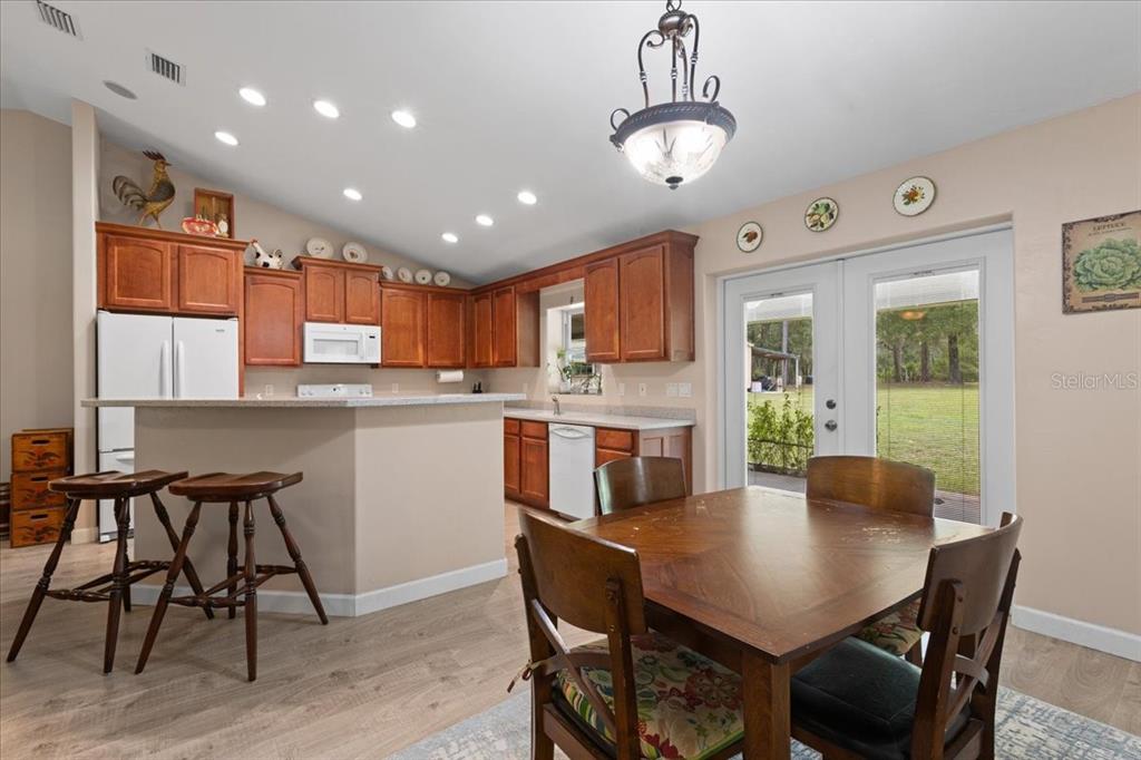 4700 Northwest 55th Avenue Bell, FL 32619 - Photo 10 of 77 a view of a dining room with furniture window and wooden floor
