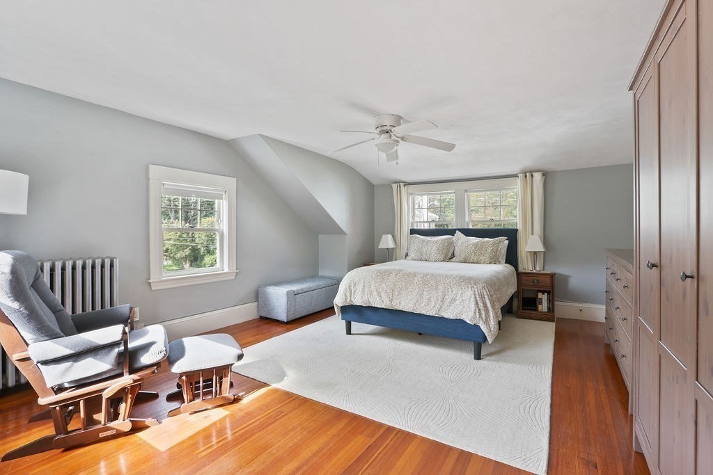 60 Oak Street Needham, MA 02492 - Photo 13 of 23 a bedroom with a bed and a chair