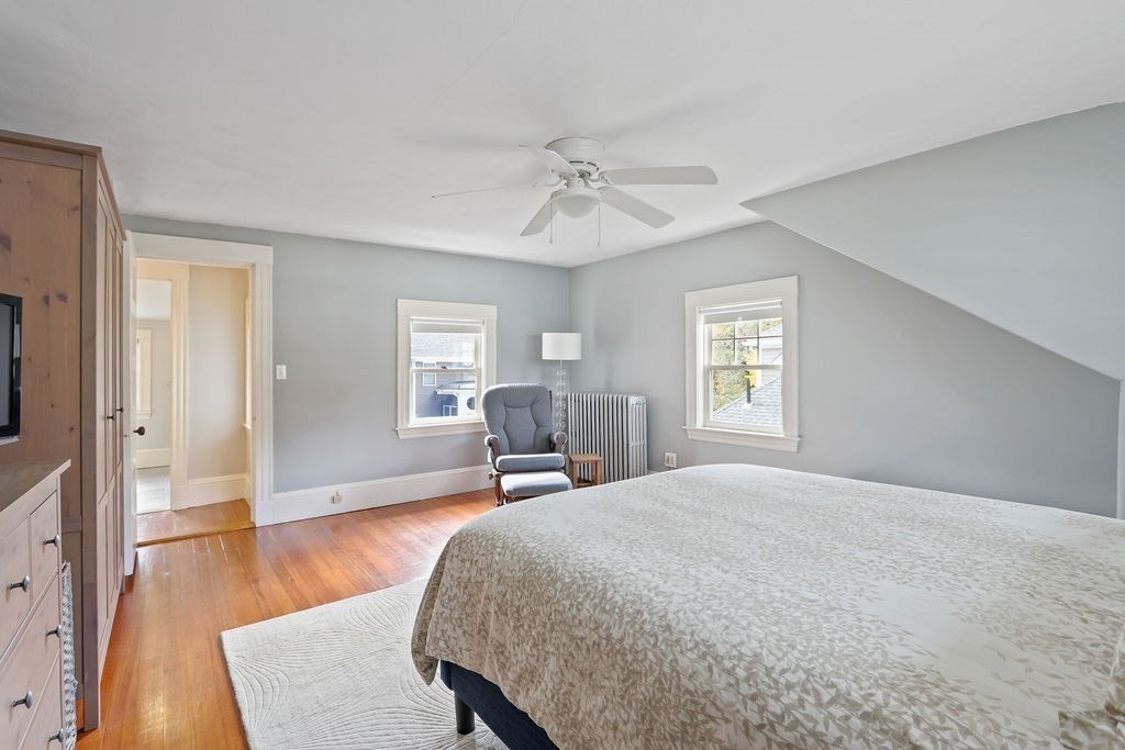 60 Oak Street Needham, MA 02492 - Photo 14 of 23 a spacious bedroom with a bed and wooden floor
