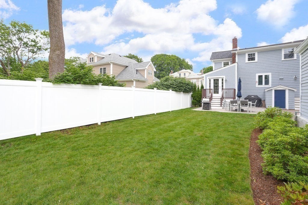 60 Oak Street Needham, MA 02492 - Photo 22 of 23 a front view of a house with garden