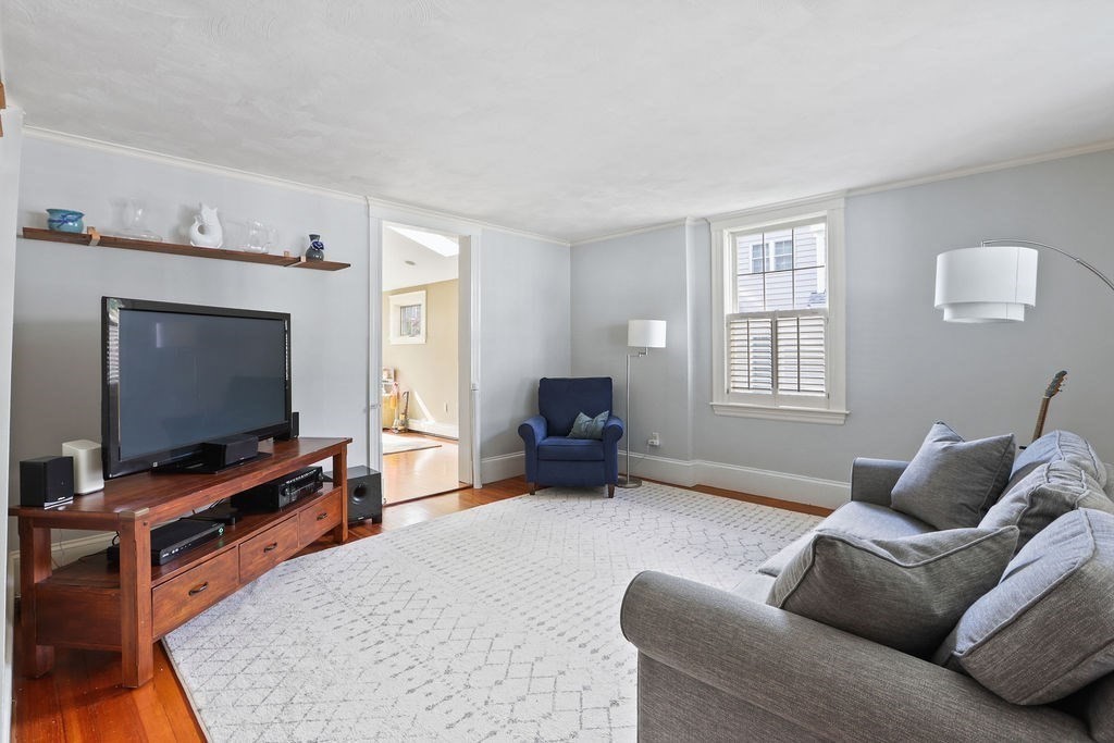 60 Oak Street Needham, MA 02492 - Photo 3 of 23 a living room with furniture and a flat screen tv