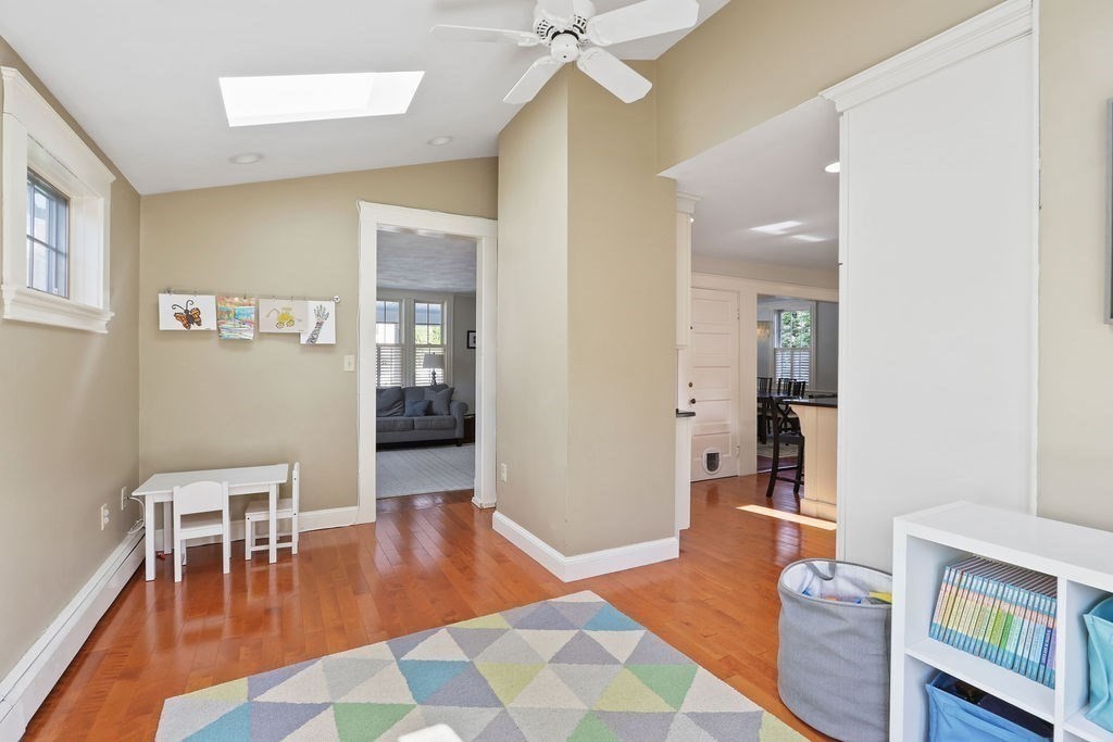 60 Oak Street Needham, MA 02492 - Photo 5 of 23 a living room with furniture and a dining table with wooden floor