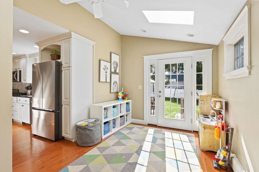 60 Oak Street Needham, MA 02492 - Photo 6 of 23 a kitchen with stainless steel appliances granite countertop a refrigerator and a stove top oven