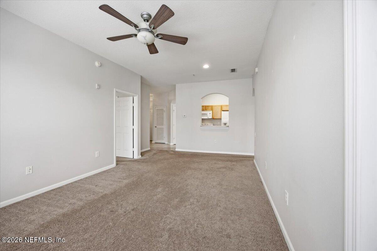 7990 Baymeadows Road East, Unit 422 Jacksonville, FL 32256 - Photo 7 of 17 06-Living Area to Kitchen