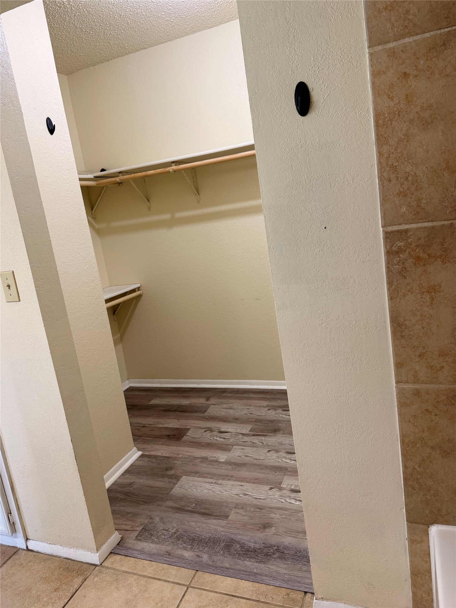 5931 Limmer Loop Hutto, TX 78634 - Photo 19 of 22 Walk in closet featuring light tile patterned flooring