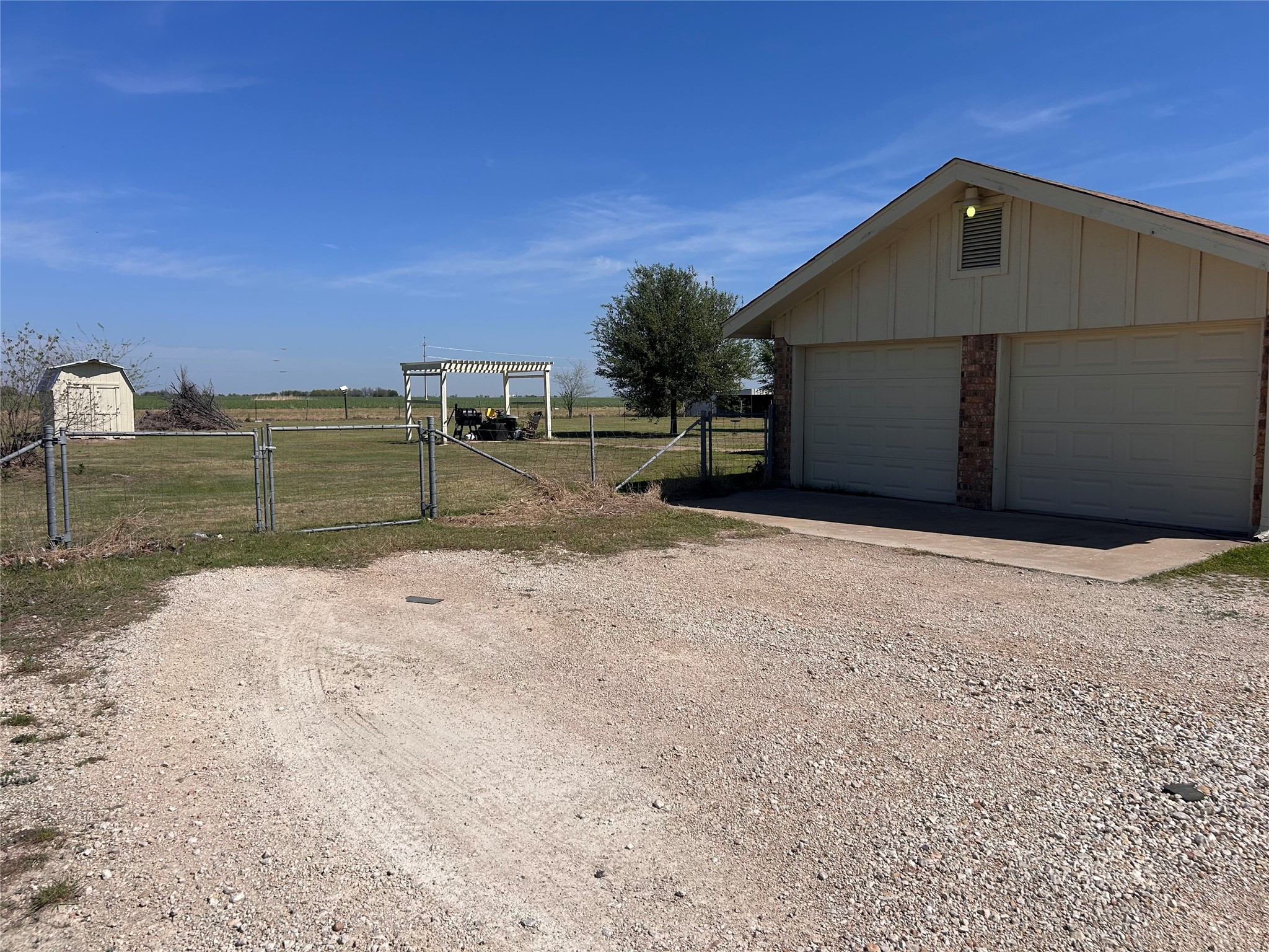 5931 Limmer Loop Hutto, TX 78634 - Photo 5 of 22 Detached garage featuring a gate