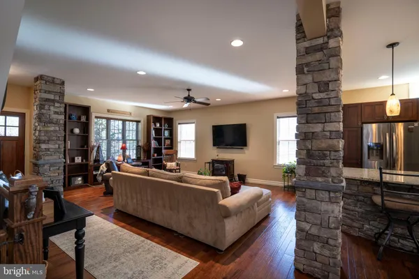 a view of a kitchen with a sink and large window
