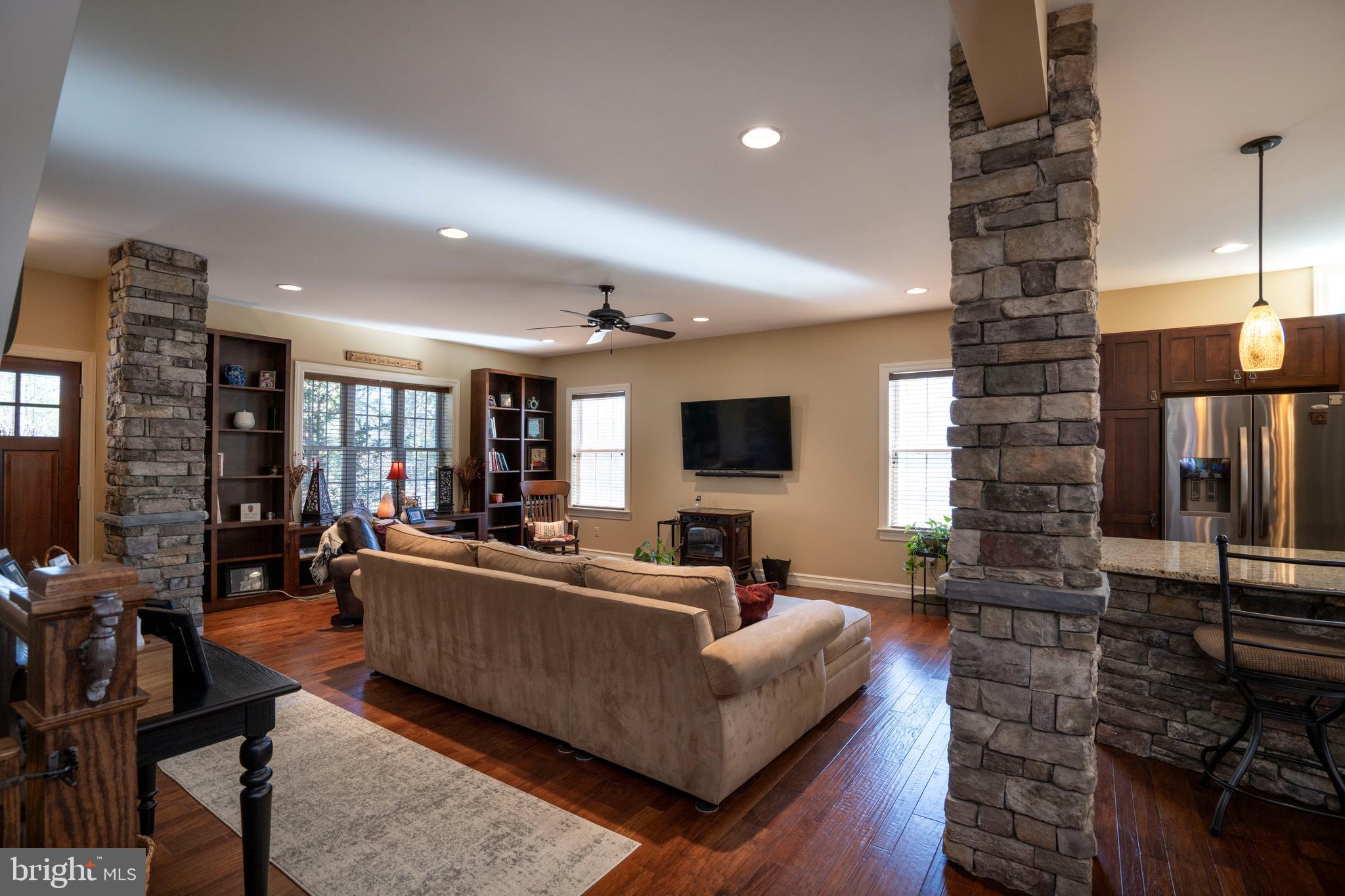 10620 Kyper Road Huntingdon, PA 16652 - Photo 13 of 104 a living room with furniture a flat screen tv and a fireplace