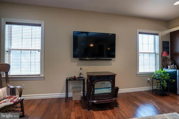 a view of livingroom with furniture and chandelier fan