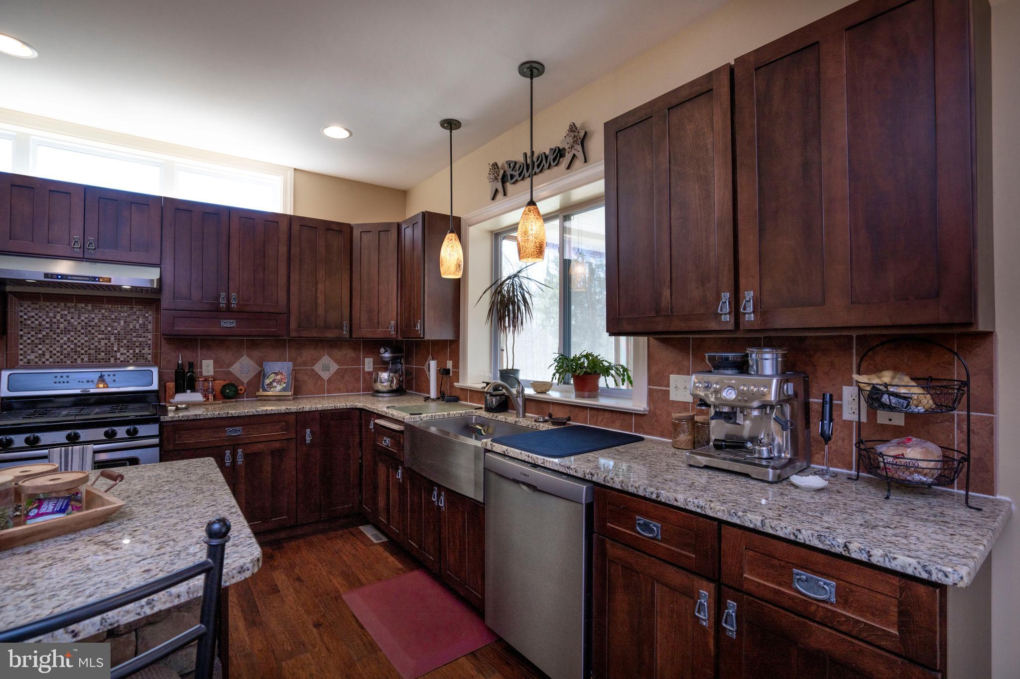 10620 Kyper Road Huntingdon, PA 16652 - Photo 19 of 104 a kitchen with wooden cabinets and a sink