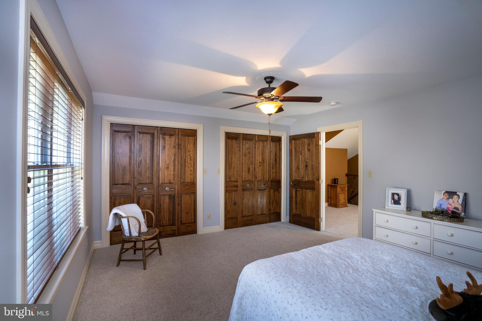 10620 Kyper Road Huntingdon, PA 16652 - Photo 33 of 104 a bedroom with a bed and a chandelier