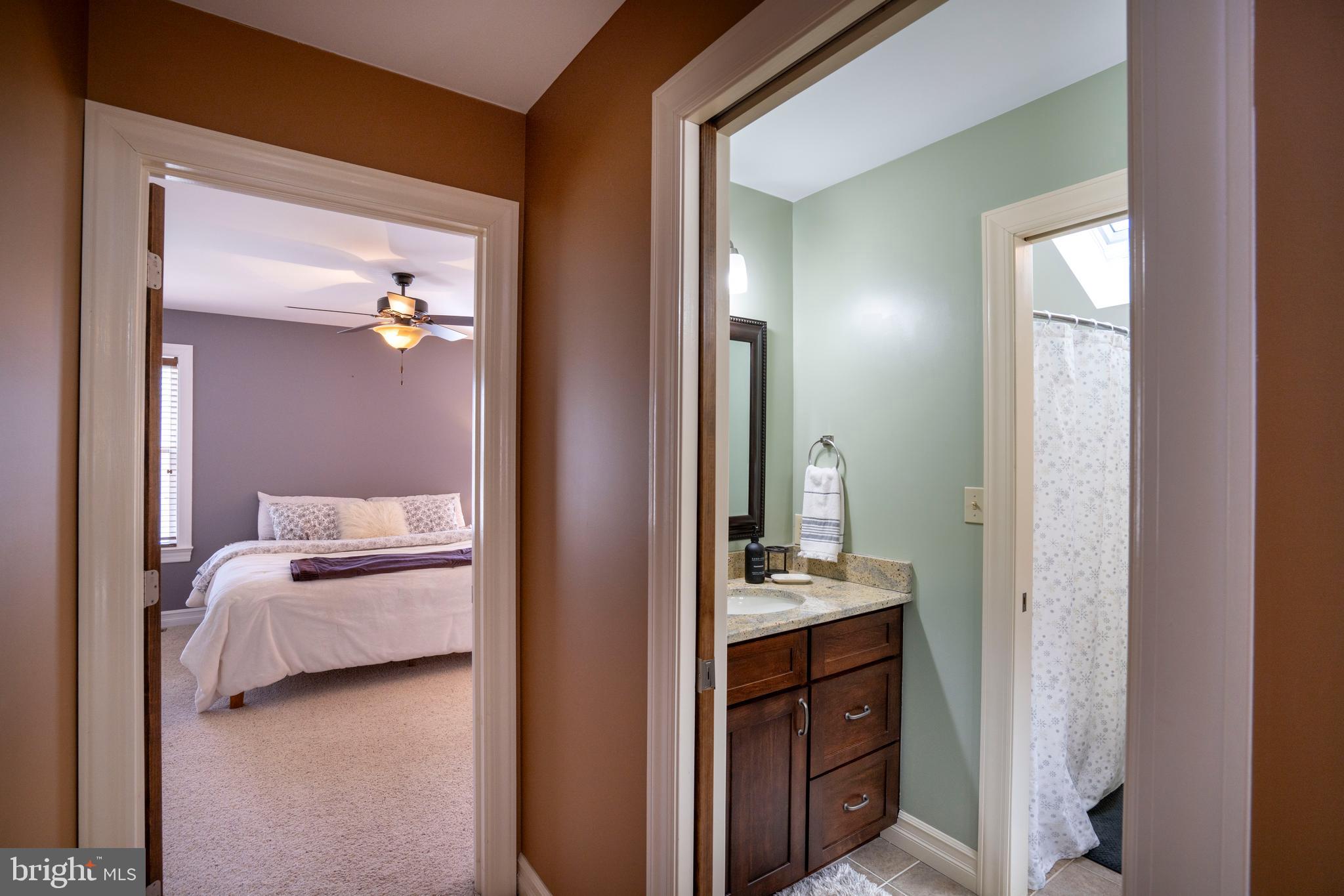 10620 Kyper Road Huntingdon, PA 16652 - Photo 50 of 104 a en suite bathroom with a sink and a mirror