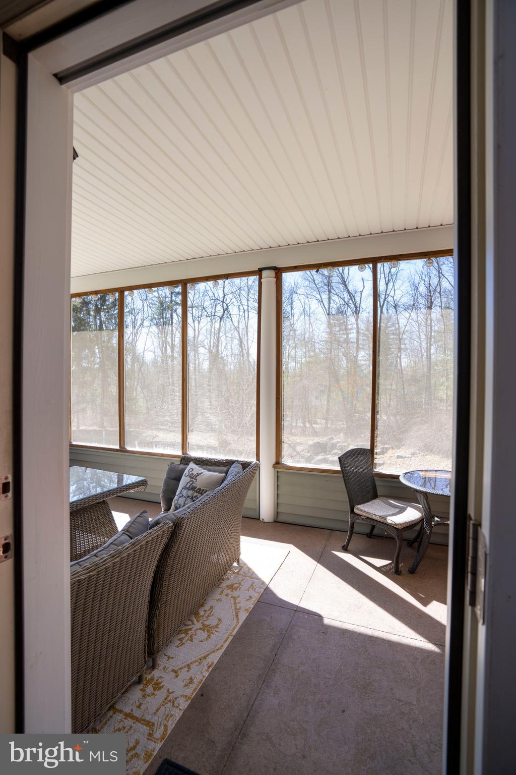 10620 Kyper Road Huntingdon, PA 16652 - Photo 71 of 104 a living room with furniture and large windows