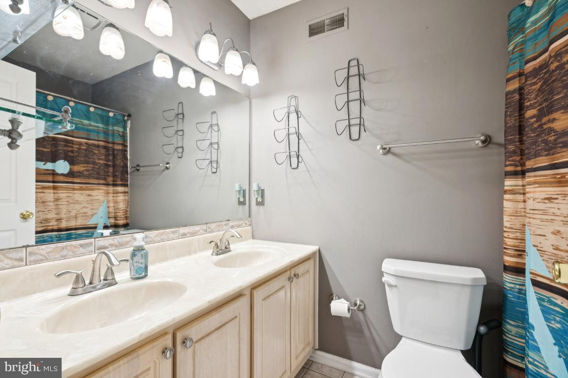 121 Weathervane Drive Mount Royal, NJ 08061 - Photo 18 of 31 a bathroom with a toilet sink and mirror