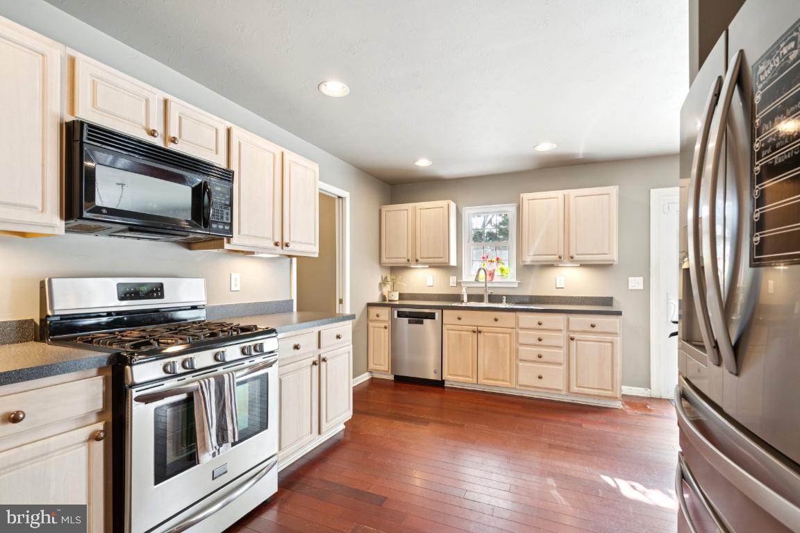 121 Weathervane Drive Mount Royal, NJ 08061 - Photo 6 of 31 a kitchen with granite countertop a sink stainless steel appliances and cabinets