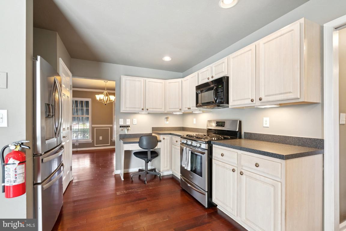 121 Weathervane Drive Mount Royal, NJ 08061 - Photo 7 of 31 a kitchen with stainless steel appliances granite countertop a stove a sink dishwasher and a microwave oven with cabinets