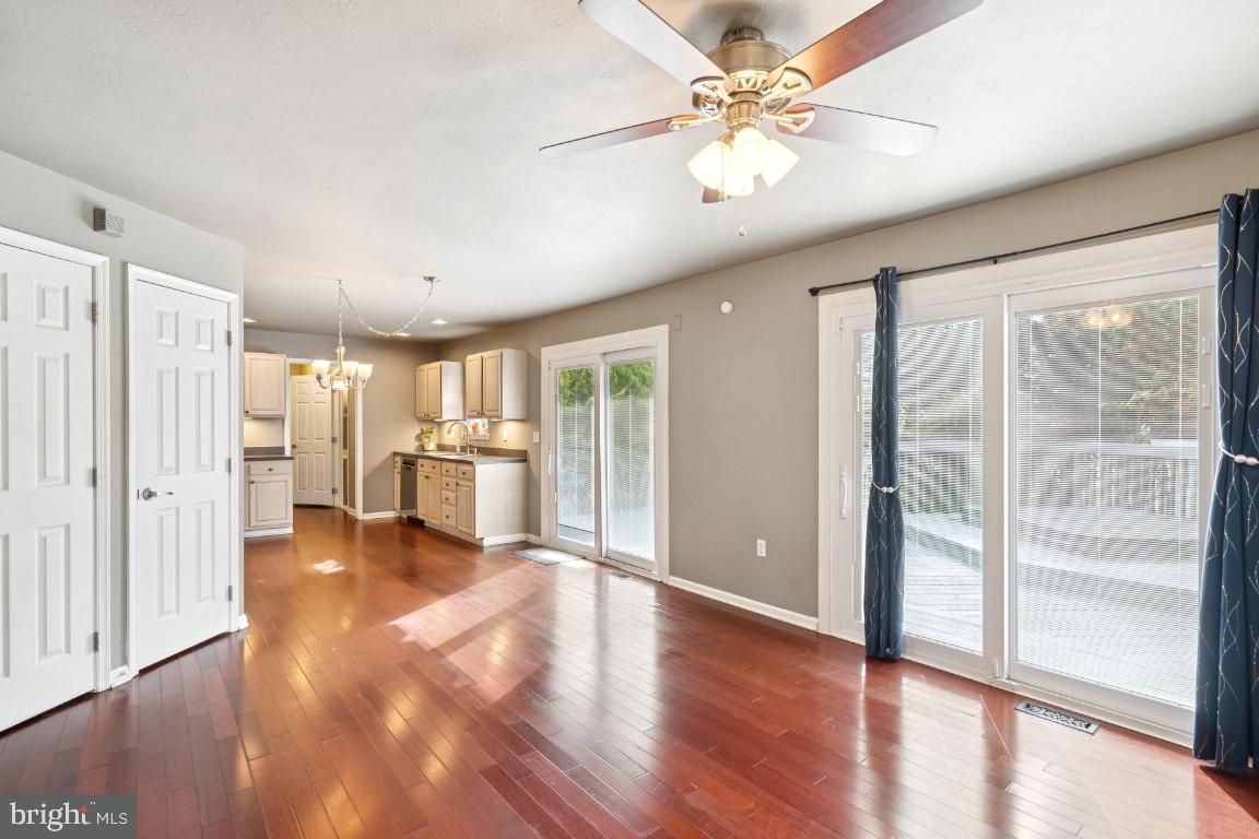 121 Weathervane Drive Mount Royal, NJ 08061 - Photo 8 of 31 a view of a kitchen with wooden floor and a ceiling fan