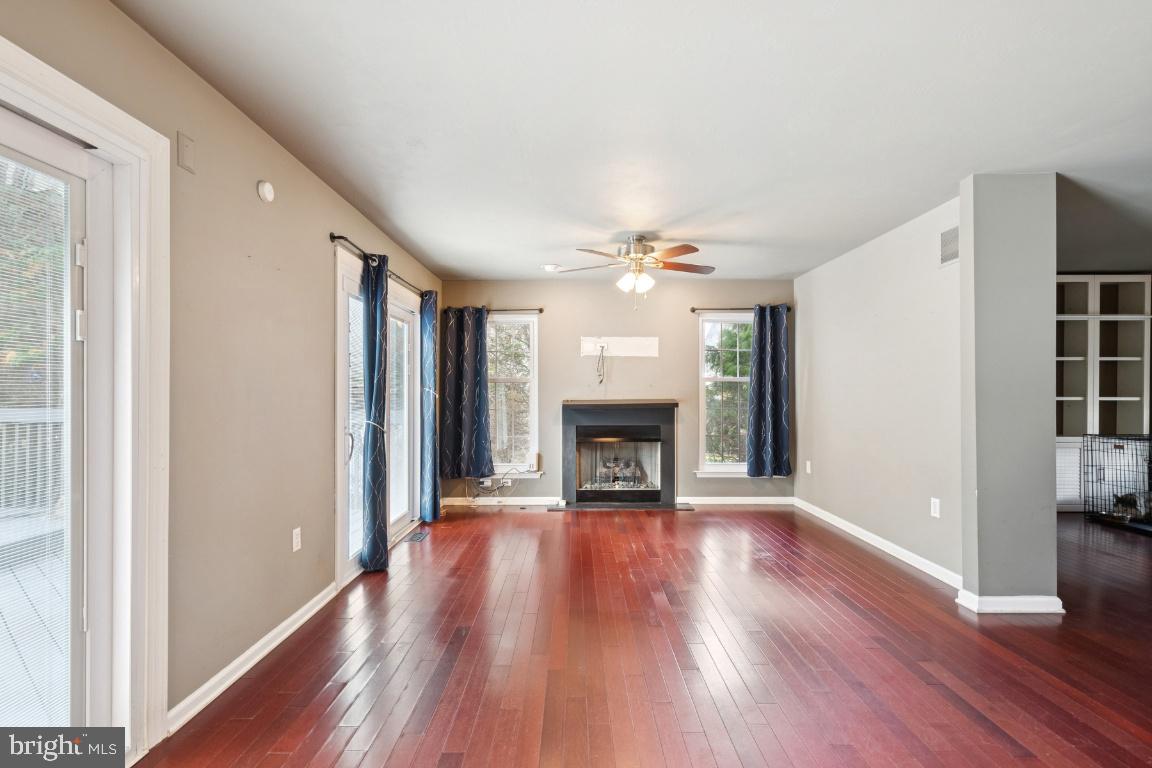 121 Weathervane Drive Mount Royal, NJ 08061 - Photo 9 of 31 a view of an empty room with wooden floor and a window