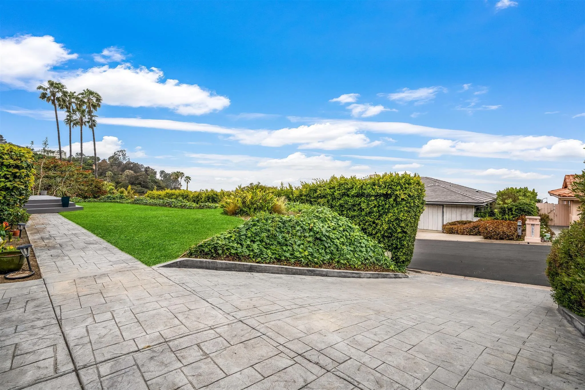 7356 Rue Michael La Jolla, CA 92037 - Photo 11 of 48 a view of a garden with a pathway