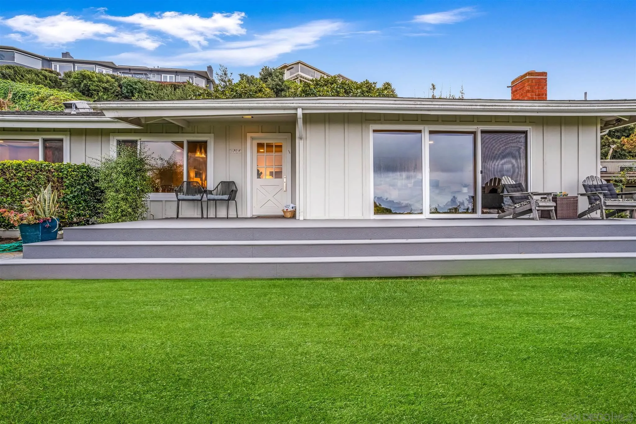 7356 Rue Michael La Jolla, CA 92037 - Photo 13 of 48 a front view of a house with a yard