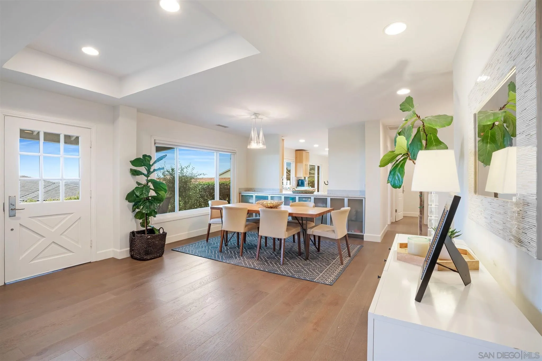 7356 Rue Michael La Jolla, CA 92037 - Photo 19 of 48 a view of a dining room with furniture window and wooden floor