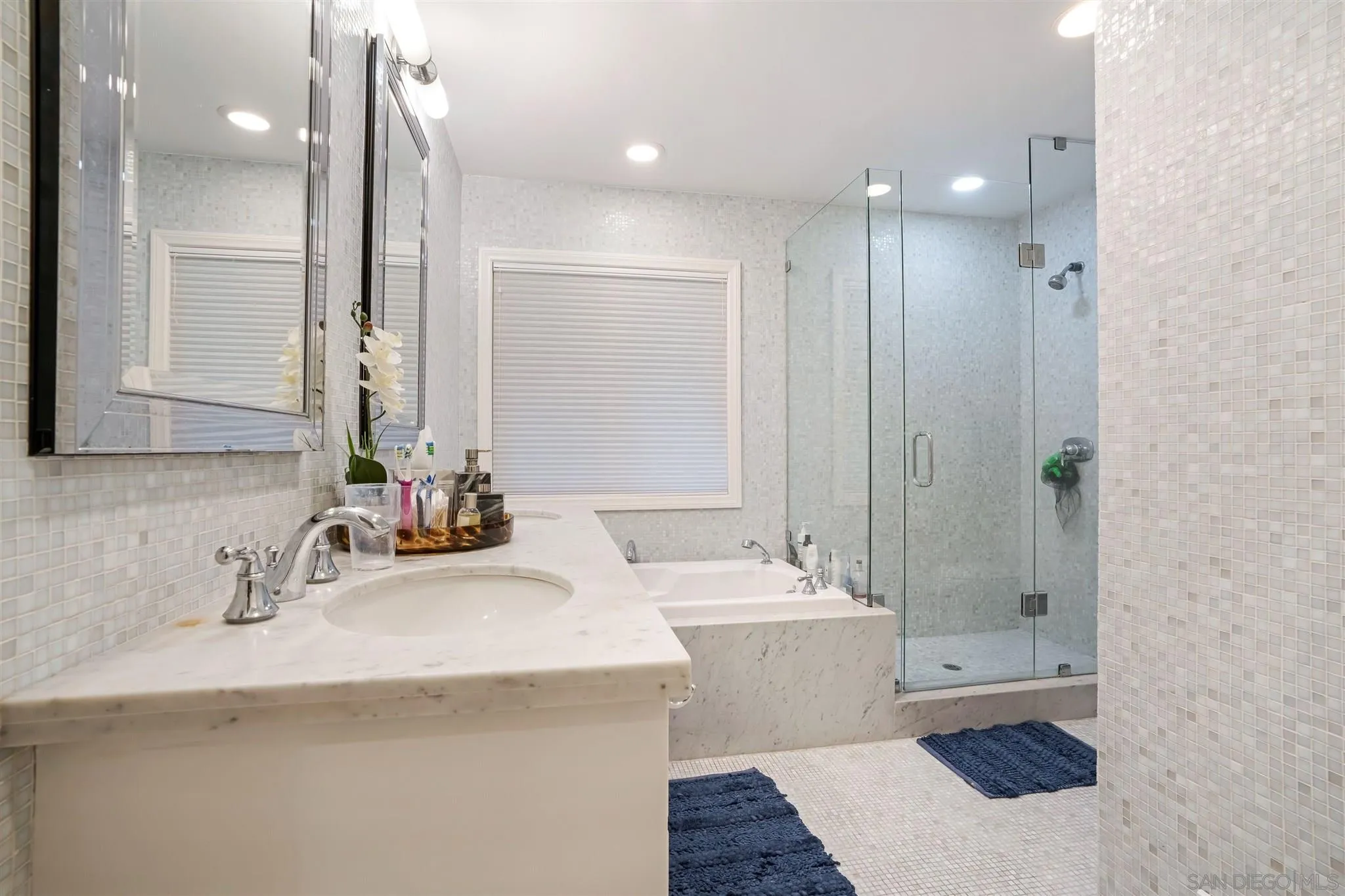 7356 Rue Michael La Jolla, CA 92037 - Photo 23 of 48 a bathroom with a tub sink and mirror