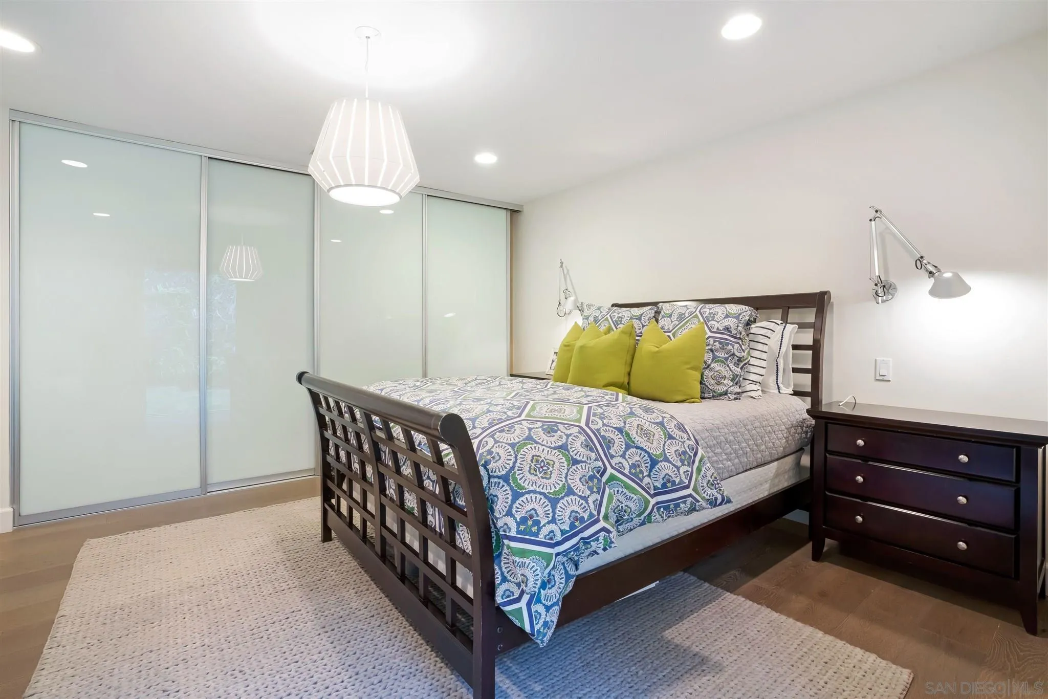7356 Rue Michael La Jolla, CA 92037 - Photo 25 of 48 a bedroom with a bed and a chandelier