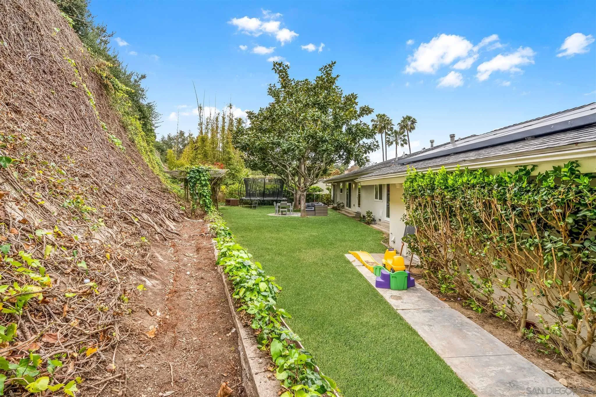 7356 Rue Michael La Jolla, CA 92037 - Photo 39 of 48 a front view of a house with a yard