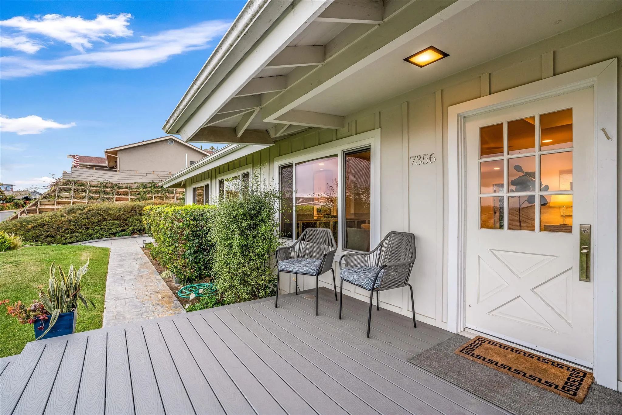 7356 Rue Michael La Jolla, CA 92037 - Photo 7 of 48 a porch with seating space and a yard