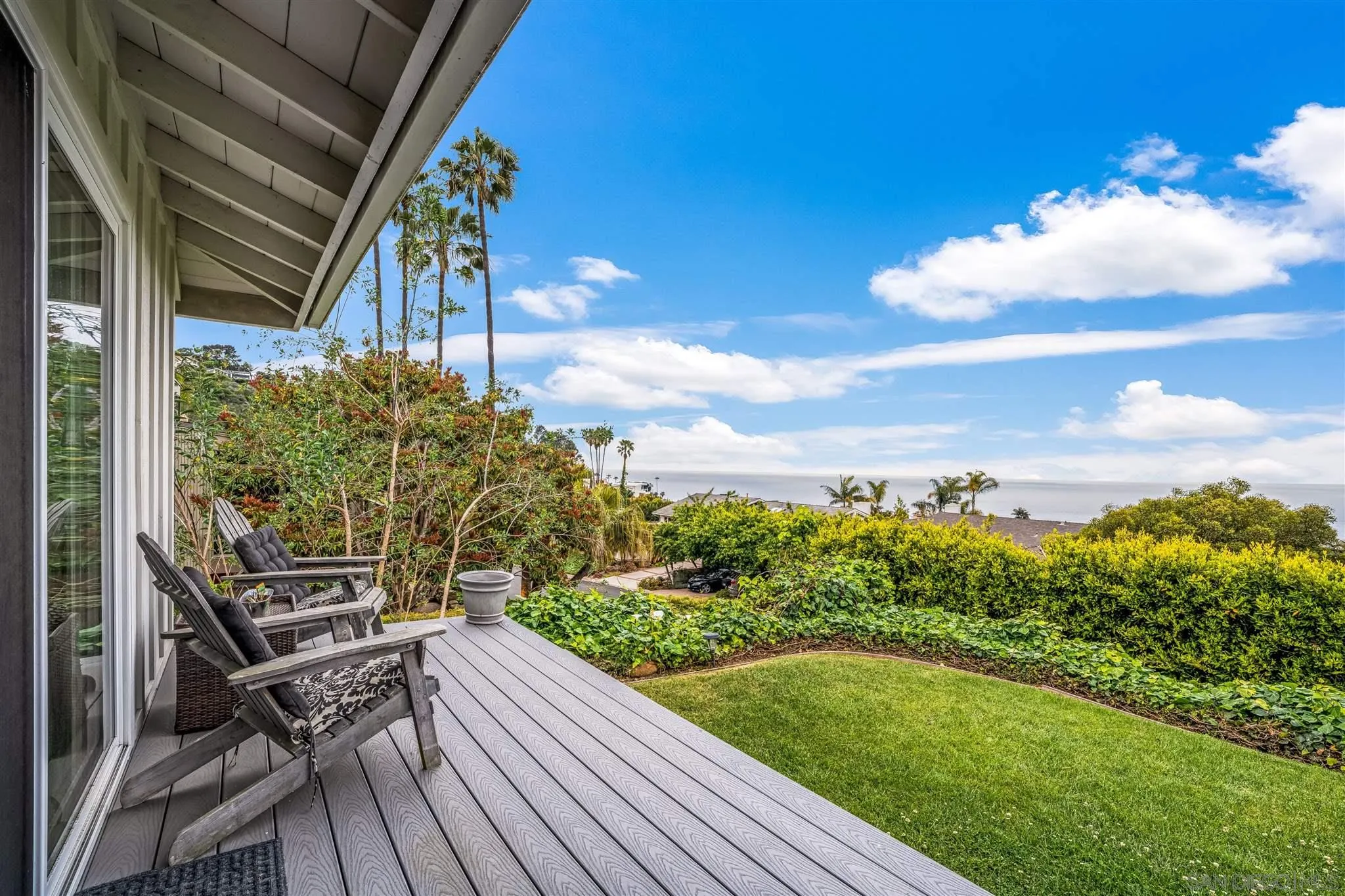 7356 Rue Michael La Jolla, CA 92037 - Photo 8 of 48 a view of a chairs and table on the wooden deck