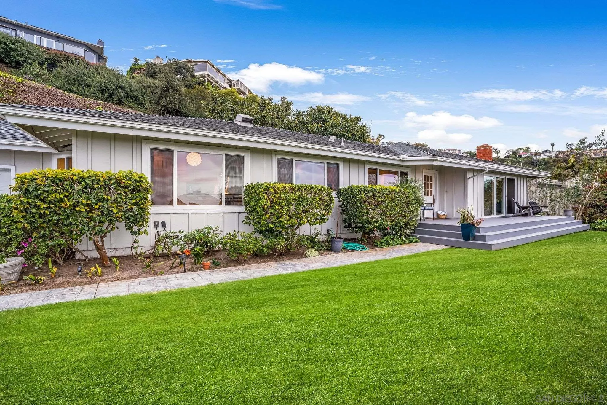 7356 Rue Michael La Jolla, CA 92037 - Photo 9 of 48 a front view of house with yard and green space