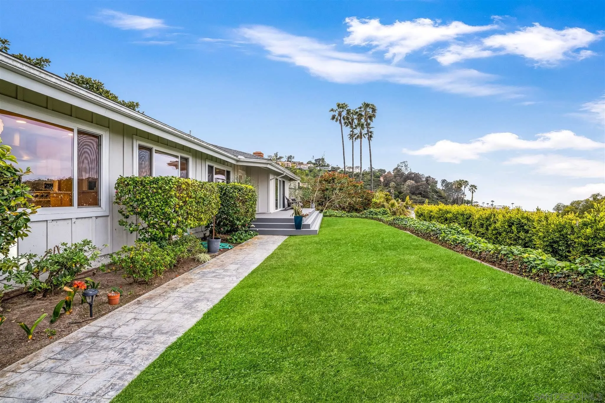 7356 Rue Michael La Jolla, CA 92037 - Photo 10 of 48 a front view of a house with garden