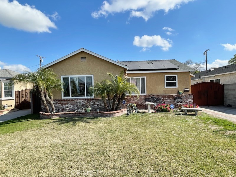 a view of a house with backyard porch and sitting area