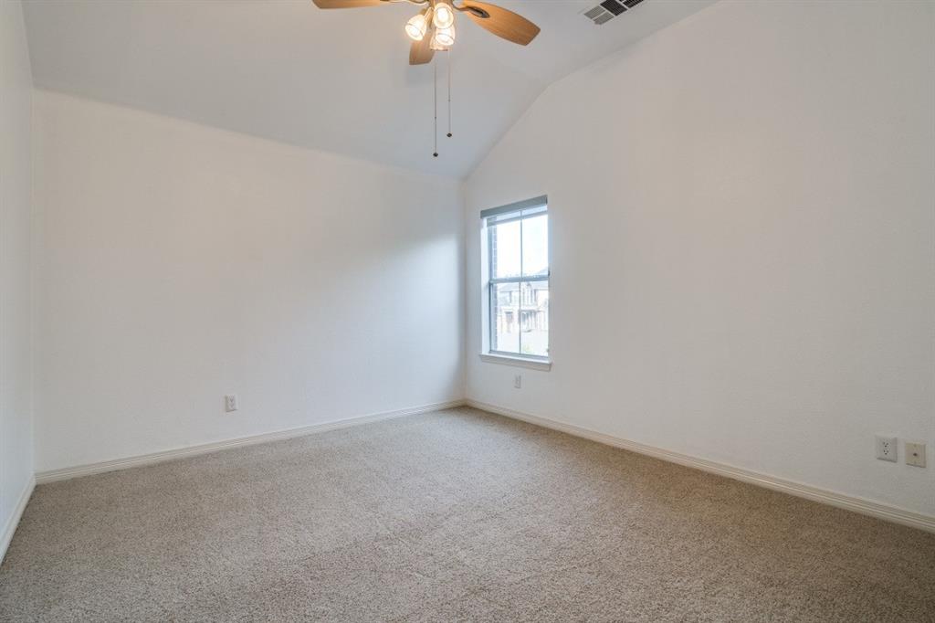 8810 Edgelake Trail Rowlett, TX 75088 - Photo 12 of 20 an empty room with a window and chandelier fan