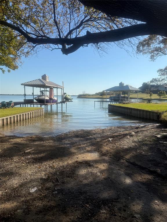 8810 Edgelake Trail Rowlett, TX 75088 - Photo 20 of 20 a view of a lake with a big yard