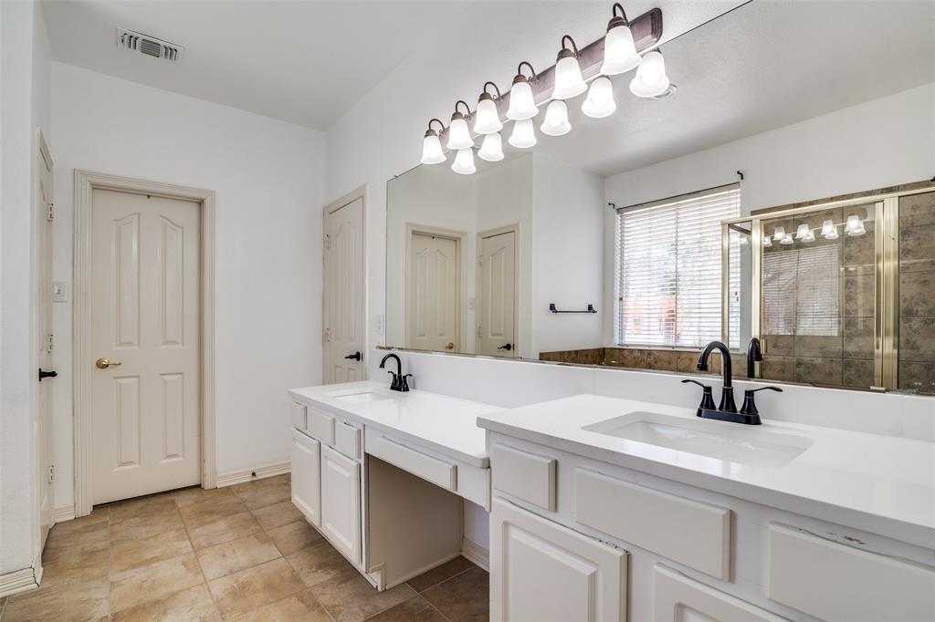 8810 Edgelake Trail Rowlett, TX 75088 - Photo 10 of 20 a bathroom with a sink double vanity and a mirror