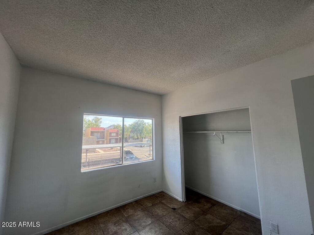 2838 East Marconi Avenue, Unit 203 Phoenix, AZ 85032 - Photo 14 of 22 an empty room with windows