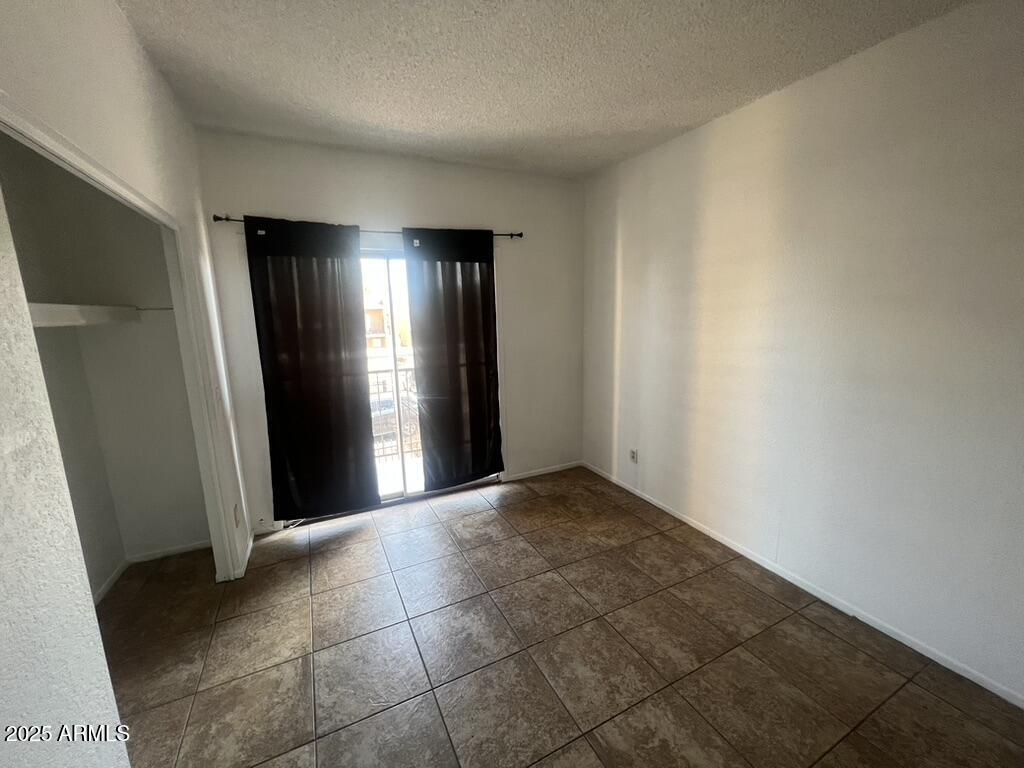 2838 East Marconi Avenue, Unit 203 Phoenix, AZ 85032 - Photo 18 of 22 an empty room with closet