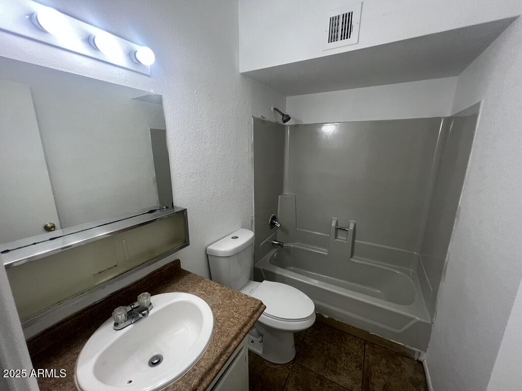 2838 East Marconi Avenue, Unit 203 Phoenix, AZ 85032 - Photo 22 of 22 a bathroom with a sink a toilet and shower